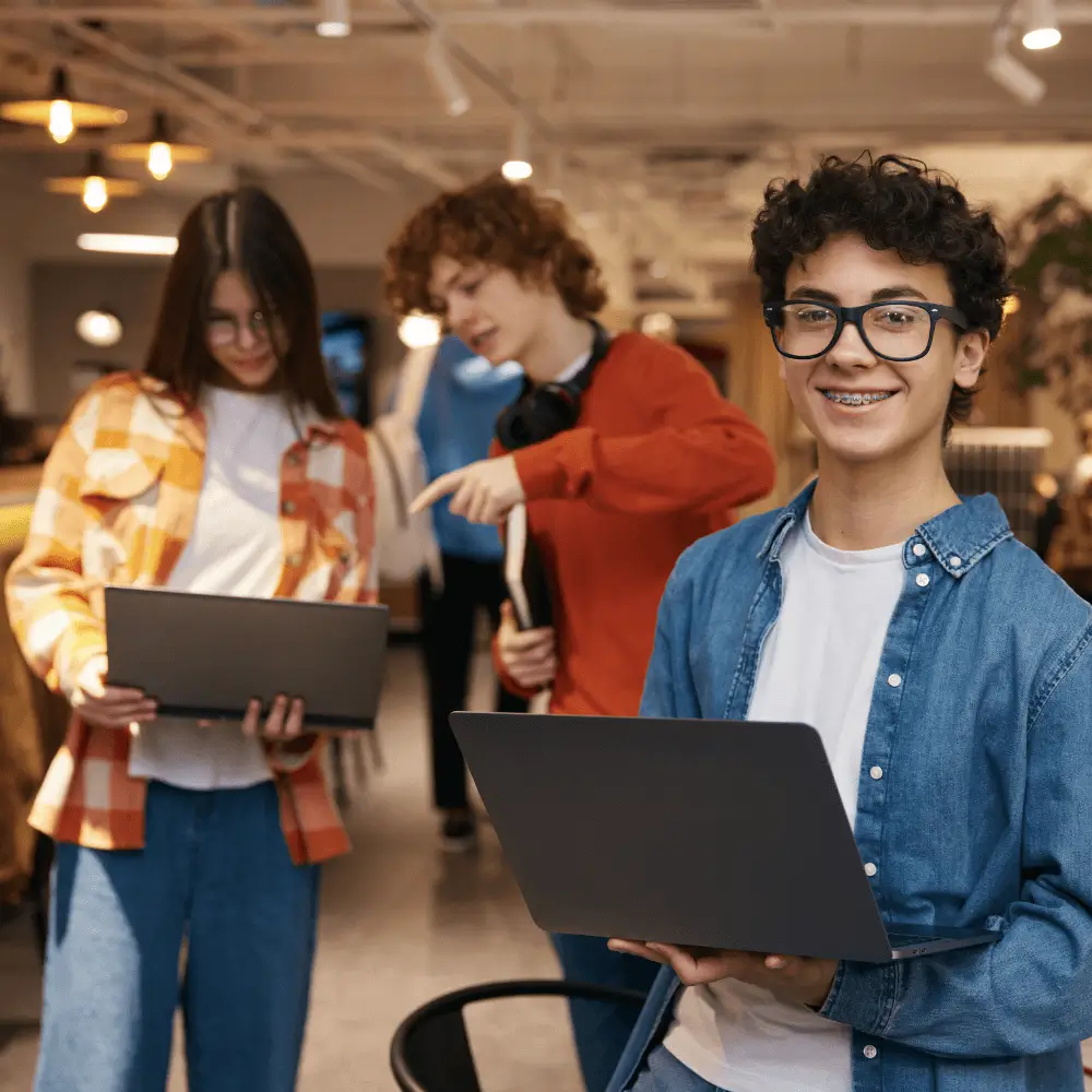 Teens in AI with laptops