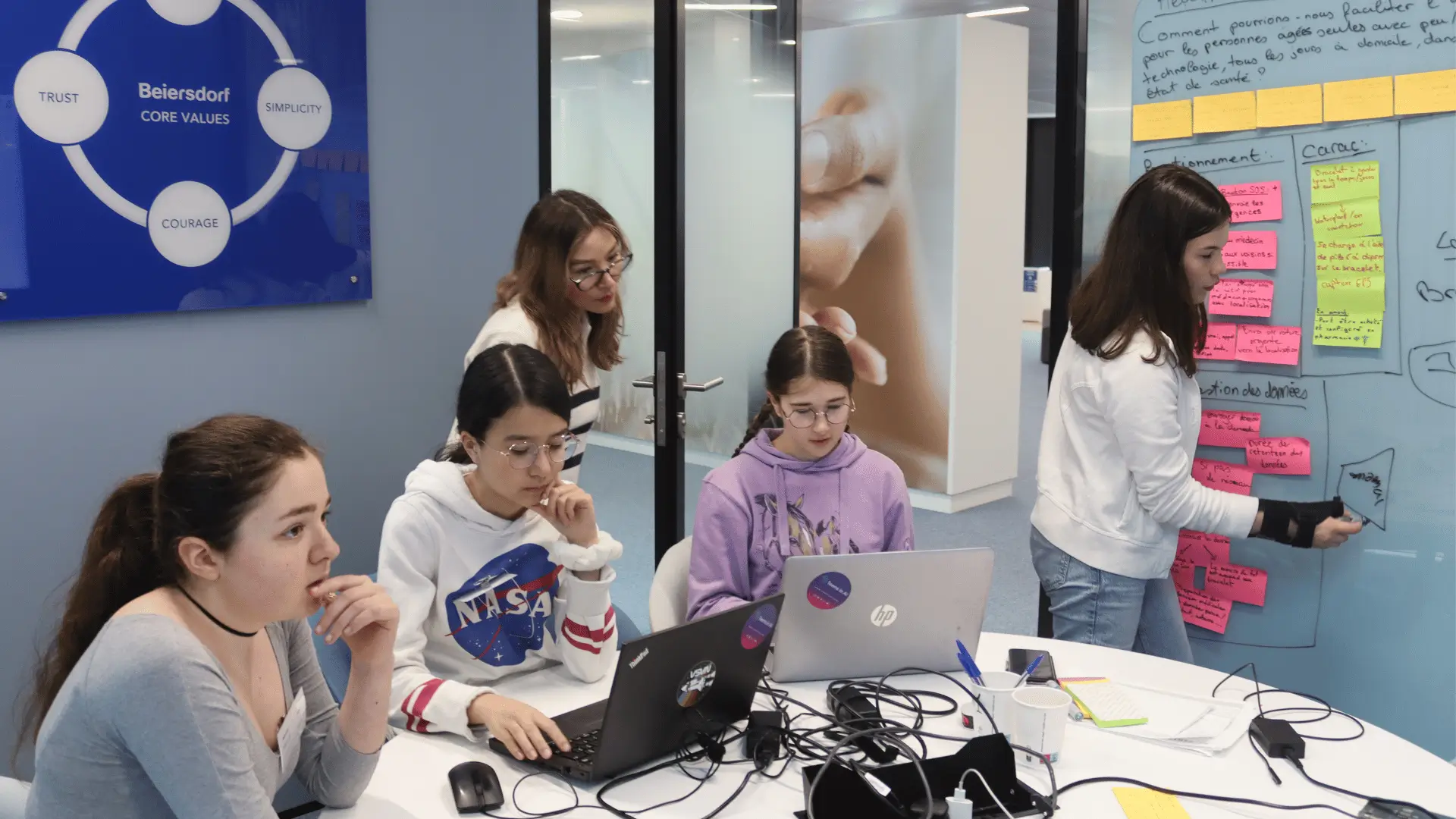 Teenagers participating in a Beiersdorf-sponsored AI hackathon with Teens in AI