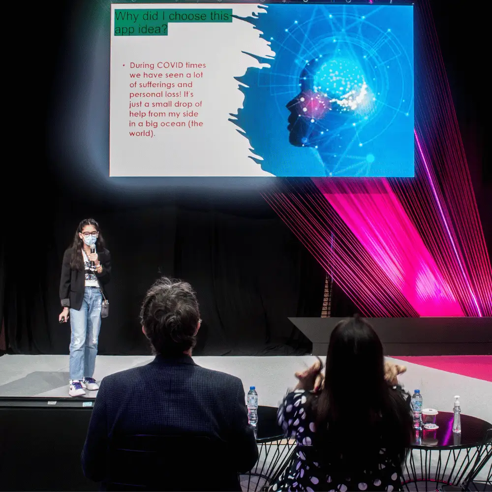 Student presenting an AI project at GITEX as part of the Nord Anglia and Teens in AI UAE programme